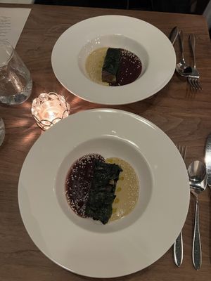 Breadcrumb stuffed kale, port wine reduction, cream sauce  at Avelo in Toronto