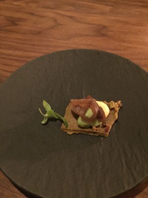 Pistachio cracker with edamame purée and something else at Avelo in Toronto