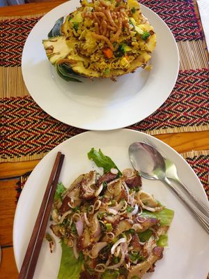 Pineapple fried rice and spicy crispy fake chicken salad at Vegan Heaven in Chiang Mai