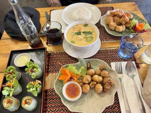 Fresh spring rolls, money bags, red curry and spicy califlower wings  at Vegan Heaven in Chiang Mai