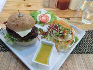 burger with 'chz and salad at Vegan Heaven in Chiang Mai