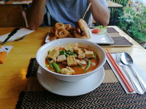 Tom yum with noodles and hot dog with onion rings at Vegan Heaven in Chiang Mai