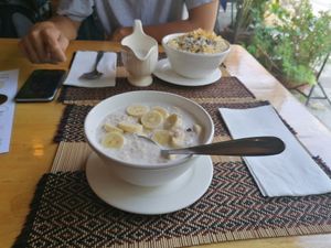 Porridge and fruit salad with muesli (a bit dry) , both with a choice of coconut or soy milk at Vegan Heaven in Chiang Mai
