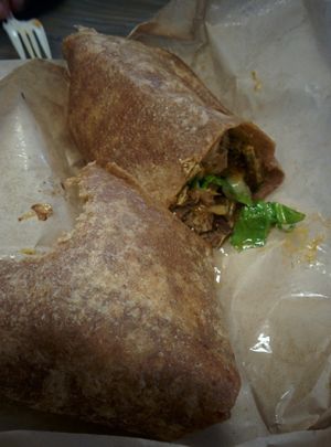 Bar-B-Chew wrap; vegan steak, onions, smoked cabbage, mozarella on whole wheat tortilla  at The Veg Hub in Oakland