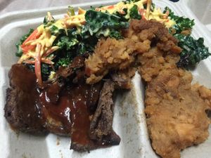 portersteak with barbeque sauce with the side of candy yam and kale salad topped with their cheese. delicious delicious!!!  at The Veg Hub in Oakland