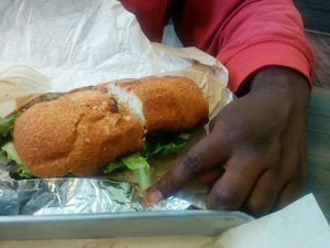 Delicious Philly cheese steak with jalapeno ranch dressing on Dutch crunch bread at The Veg Hub in Oakland