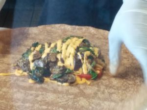 Prepping BarBChew philly cheese steak quesadilla at The Veg Hub in Oakland