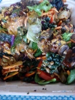 Spinach mushroom melt on salad base of kale, red leaf, romaine lettuces, loaded with artichoke, carrots, dried cranberries, pumpkin seeds, jalapenos, olives, beans... at The Veg Hub in Oakland