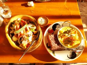 The Ceasar and yellow curry with rice - best of the best! at Happy Veggie in Koh Lanta