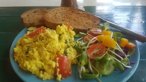 Most amazing tofu scrumble with onion, tomato and spinach. So So delicious! at Happy Veggie in Koh Lanta