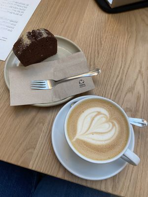 Oat latte, coconut chocolate cake  at Mok in Brussels