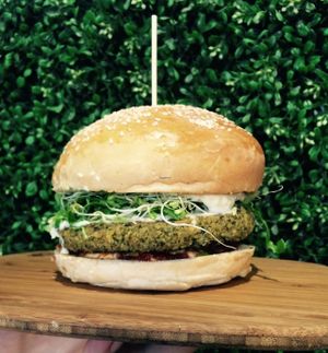 Herbivore's Falafel Burger has a perfect combination of ingredients to make your taste buds sing! Homemade matbucha, falafel and a fresh brioche bun, we've got the best vegan burgers! at Herbivore Eatery in South Yarra