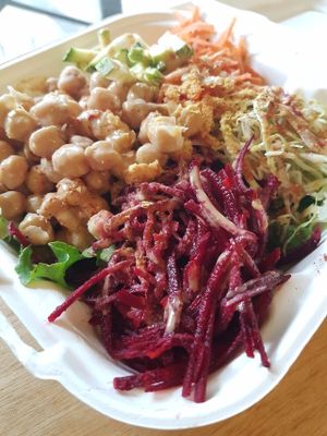 Pura vegan salad with beets, garbanzos, carrots, cabbagee, avocado and house made tahini garlic dressing at Pura Vegan in Tamarindo