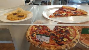 Fresh hot pizza waiting in the cabinet. at Nicoletta's Cake Boutique in Wellington