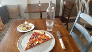 A slice and a cookie biscuit for a quick tasty lunch. at Nicoletta's Cake Boutique in Wellington