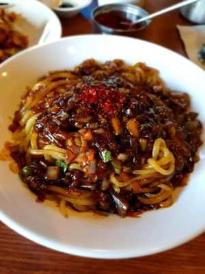 covering my noodles...and a spoonful of chilli that is on table at HaGoong - 하궁 in Seoul