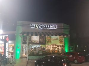 Outside of the store by night at Veganza Emporio in Salvador