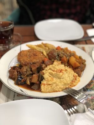Another plate with hummus, potato and eggplants  at Vegan Istanbul in Istanbul