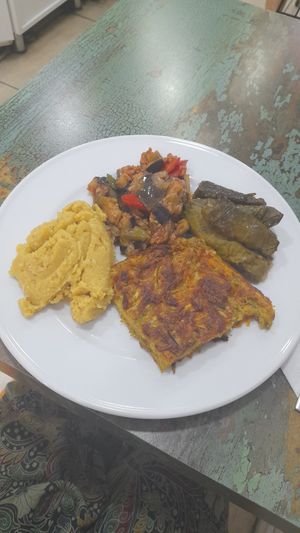 Aubergine, dolmades, Hummus, and zucchini patty at Vegan Istanbul in Istanbul