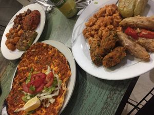 Variety of dishes accompanied with turkish pizza  at Vegan Istanbul in Istanbul