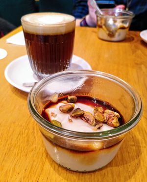 Flat white (almond milk) + Mouhalabieh at Judy in Paris