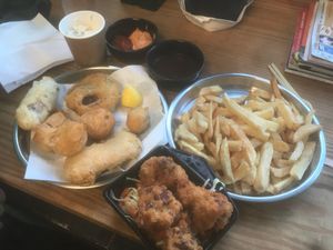 Battered sausage, mushy peas fritter, jack fruit balls, tofish and cauliflower  at Matter Fastfoods in Bristol