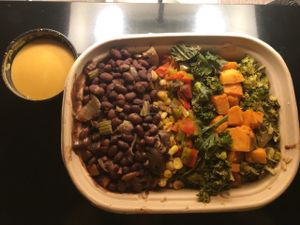 Brown rice and quinoa bowl with red coconut curry sauce at PlantPure Cafe in Philadelphia