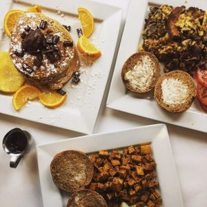 Crêpes farcies aux bananes et chocolat tahini, Tofu brouillé et Omelette de pois chiches et champignons at Vegano in Montreal