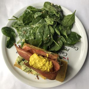 Polenta, tofu brouillé, guacamole et bacon at Vegano in Montreal