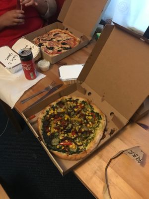 Vegan pesto-based pizza (background pizza is ham and mushroom) at Stoned Pizza in Dublin