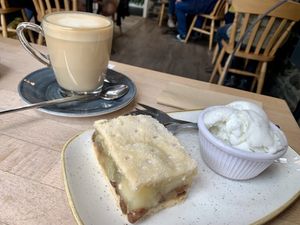 Apple pie and ice cream with oat milk latte at The Apple Pie in Ambleside