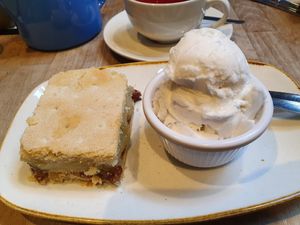 Apple & sultana slice, ice cream. at The Apple Pie in Ambleside