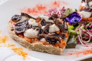 Raw Pizza with mushrooms at HappyRaw Natural Restaurant in Faenza