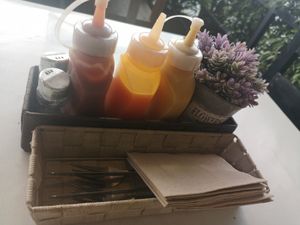 Ketchup, mustard and spicy sauce on the table at 31burger in Hua Hin