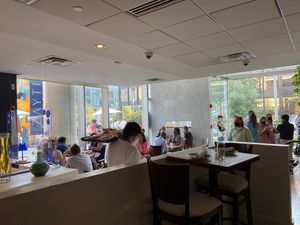 Large interior with a variety of types of seating and also outdoor seating  at Zaytinya in Washington