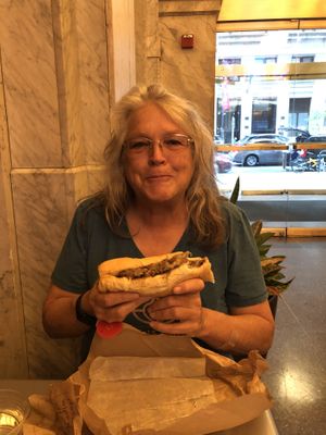 Mom eating the best Philly cheesesteak ever at HipCityVeg - Broad St in Philadelphia