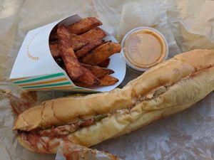 Philly cheese steak but with chick'n fajita and sweet potato fries with Sriracha aioli at HipCityVeg - Broad St in Philadelphia