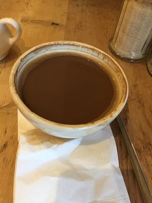 Shallow bowls spilling coffee no room for milk at Le Pain Quotidien - Westfield in London