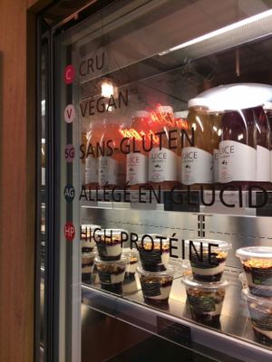 Things are clearly labeled. Look for the colors corresponding to what you want (raw, vegan, gluten-free, low-carb, high-protein). at Detox Delight - CMG Sports Club in Paris