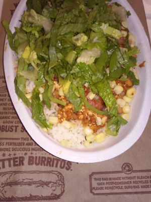 My sofritas burrito bowl. It contains white rice, sofritas, mild salsa, corn, and lettuce. Delicious! at Chipotle  in Moreno Valley