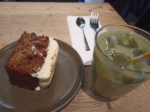 Carrot cake and iced matcha with soy milk at Le Pain Quotidien - St Pancras in North London