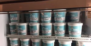 Cooler of rotating grab n go pints at Eb & Bean - Division  in Portland