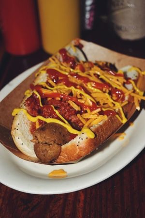 Vegan chili cheese dog with poppyseed bun at Frank in San Antonio