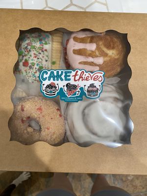 cereal milk pop tart, strawberry shortcake donut ?? i think (bottom left) SO GOOOD, strawberry croissant is filled w pink cream cheese, cream cheese frosted cinnamon roll  at Cake Thieves in San Antonio