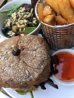 Menu of cheesy bbq burger with brown bread  at Mooshka in Amsterdam