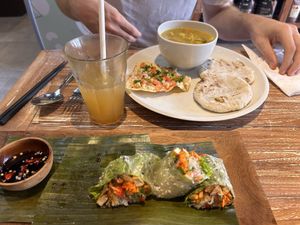 Tasty fresh spring rolls and curry in the back  at Bodhi Leaf Eatery in Denpasar