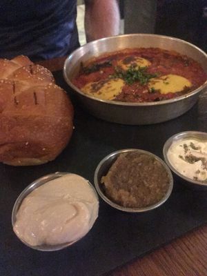 Shakshuka with freshly baked bread and Dips at Four One Six (416) in Tel Aviv