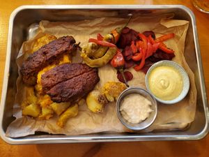 Barbecue. Nothing like U.S. barbecue - no sauce. Patties too salty. Beet root, peppers, horseradish, mustard and potatoes all excellent. at Balans Bistro in Bratislava