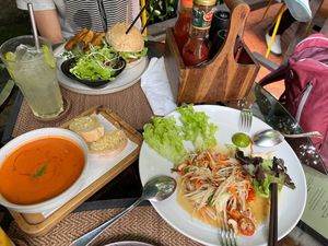 Tomato soup delicious papaya salad and a burger  at Reform Kafe in Chiang Mai