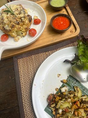 Yummy tea leave salad and cauliflower 💚  at Reform Kafe in Chiang Mai